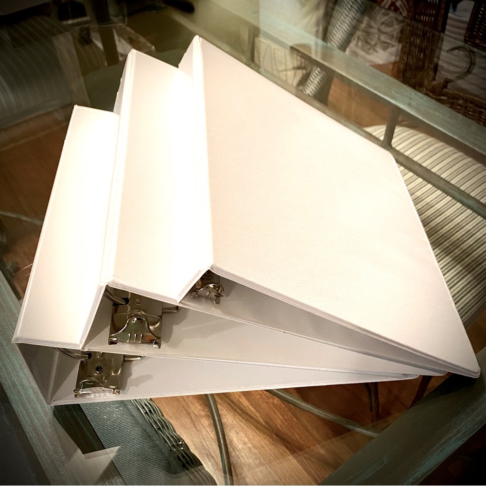 Brand new white D-ring style binders.